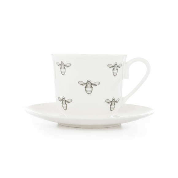 A delightful fine bone china 'oversized' breakfast teacup and saucer with a Bee illustration.  Repeat Bee design to the large teacup and single Bee illustration to the saucer.